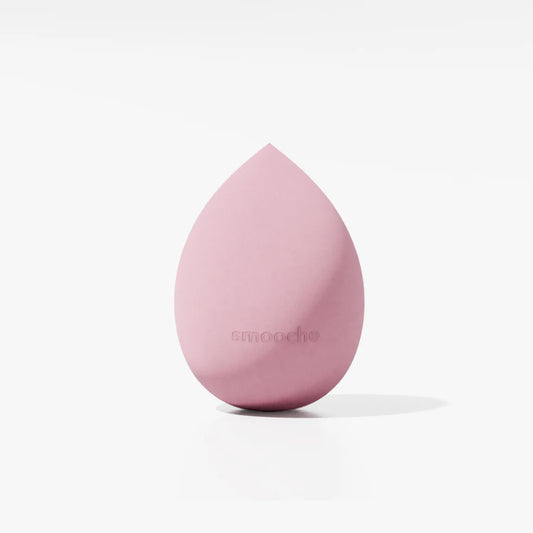 Pink Smooche Blender makeup sponge displayed on a solid background.